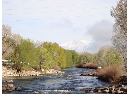 View of the Arkansas River from F Street Bridge in Downtown Salida, Colorado. 
